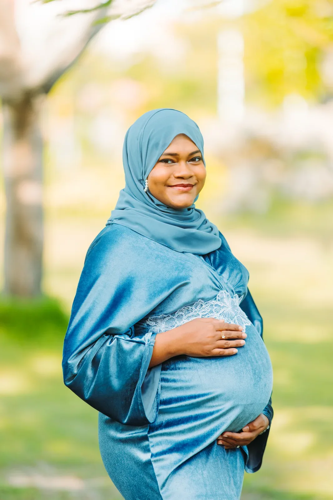 Outdoor maternity portrait in a blue dress