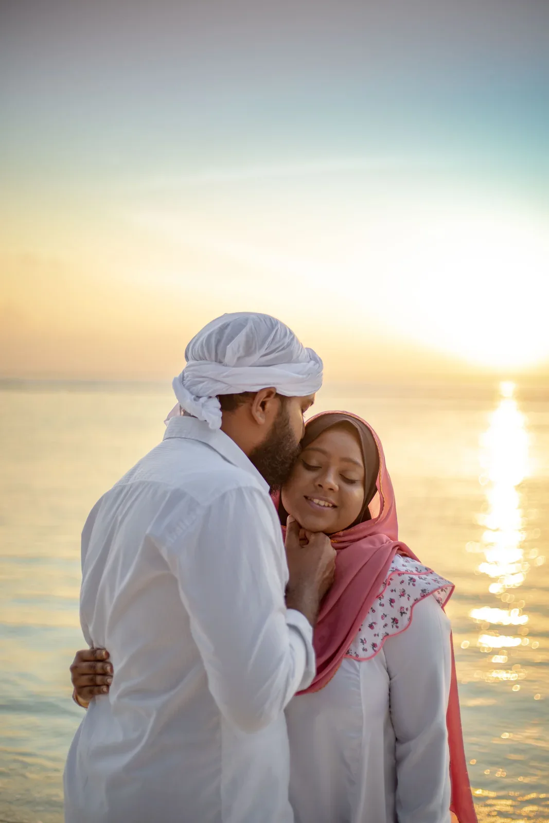 A couple sharing a quiet moment at sunset